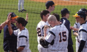 Sonny Mastromatteo and Grant Glasser celebrate with their team after the two runs. (Bradley Stringfield)