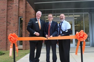 Chancellor Dr. Tom Rakes, Vice Chancellor for Academic Affairs Dr. Jerald Ogg and UT President Dr. Joe DiPietro cut the ribbon in front of the new Fine Arts Building, welcoming the crowd inside for a tour. (Alex Jacobi)