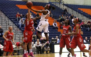 Jasmine Newsome soars of the Redhawk defender for a basket. (Malorie Paine)