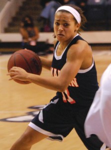 Heather Butler attempts to go around a player as she drills towards the basket while playing against Belmont. (Alex Jacobi)