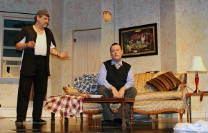 Oscar Madison is giving Felix Ungar another one of his speeches that Felix obviously does not want to hear in a scene from Masquerade Theatre’s production of “The Odd Couple.” Left to right: Todd Little as Oscar Madison and Jared Hamlin as Felix Ungar. (Sheila Scott)