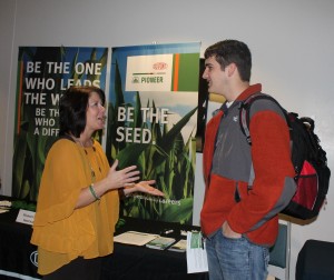 Babette McConnell, Administrative Assistant at Dupoint Pioneer Hi-Bred International, talks with Clay Dunivane, a freshman Ag Business major, about his future career. (Hannah Stewart)