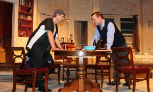 It looks like roommates Oscar Madison and Felix Ungar are at it again and it might just be about poker night this time, in a scene from Masquerade Theatre’s production of “The Odd Couple.” Left to right: Todd Little as Oscar Madison and Jared Hamlin as Felix Ungar.(Sheila Scott)