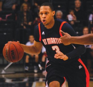 Terence Smith brings the ball down the court against Belmont. (Alex Jacobi)