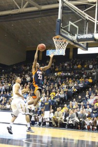 Justin Childs is airborne as he gets ready to dunk. Childs gets the dunk and the momentum for his team continues. (Tonya Evans)