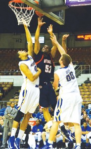 Jeremy Washington goes up for a basket as two of Morehead’s players try to quell his mission in advancing in the OVC Tournament. (Tonya Evans)