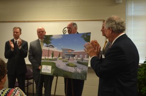 Frank McMeen, Harbert Alexander, Jr., UTM Chancellor Tom Rakes, Gov. Bill Haslam and Robert Caldwell reveal what the new addition will look like when it opens in fall of 2014. (Alex Jacobi)