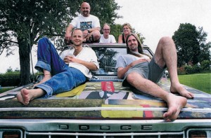The band 27bstroke6 relaxing on the band's Dodge truck in 2000. Featured on the back row from left to right is Jay McCutheon who plays drums; Andy Wilhite who plays guitar and organ; and Dr. Julie Hill who plays percussion. Featured on the front row from left to right is Micah Barnes who plays bass and sings lead vocals; and Matt Adams who plays guitar. (Julie Hill)