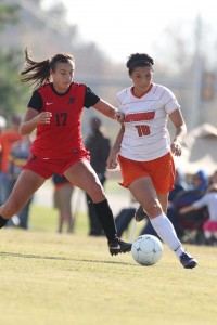 Sera fends off a players as she dribbles the ball down the pitch in hopes for a goal. (Sports Information)