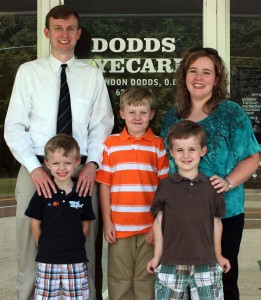 The Dodds Family is gathered in front of Dodds EyeCare in Newbern, Tenn. Pictured from left to right is UTM alumnus Dr. Brandon Dodds, Cole Dodds, UTM alumna April Baker Dodds and pictured in the front from left to right, Bo Dodds and Clay Dodds. (Sheila Scott)