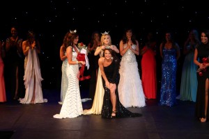 Kristen Lackey, a junior Education major from Savannah and a UTM softball player, is crowned Miss UTM 2013 by outgoing queen Bethany Meeks, a senior Communications major from Jackson. Lackey is believed to be the first UTM student-athlete to win the title of Miss UTM. (Malorie Paine)