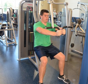 Senior Political Science major Ben Allen tries to work out in the Fitness Center during the less-crowded times. (Mary Jean Hall)