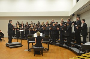 UTM Director of Choirs Dr. Mark Simmons leads the New Pacer Singers in one of their several performances for the evening. (Eric Brand)