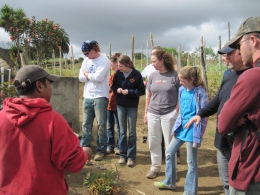 (L to R) Jose, the owner of a farm, gave a tour to Aaron Jackson, Anna Wiser, Maryanna McClure, Dr. Sandy Mehlhorn, Elizabeth Mehlhorn, 12x12 Love Project Operations Manager Chris Steed, and Josh Justice. (Mary Jean Hall)