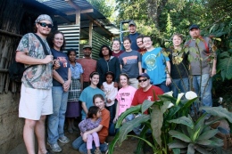 The travel study group took a few minutes away from their projects to pose for a picture with a few of the locals. (Love Project)