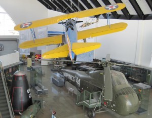 The Stearman is shown flying over the rest of the military vehicles. There is a drone helicopter, and visitors can also go inside the large Marine helicopter. (Maigan Bradbury)