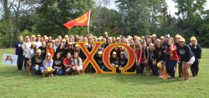 Current members of the Chi Omega sorority gather at the site of their new lodge. (Mary Jean Hall)