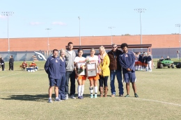 Midori Sera and Kendyl Wilson are honored after the game. (Ashley Cunningham)
