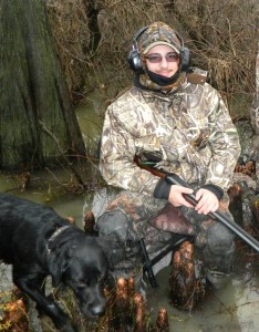 Junior mechanical engineering major Ben Walker and guide dog Kayla try to stay warm while duck hunting in Biggers, Ark. Walker saw various types of waterfowl, including shovelers, pintails, mallards and specklebelly geese, during the hunt with BMW Outfitters, which he won as a door prize at the World Deer and Turkey expo in Birmingham, Ala. (Ben Walker)