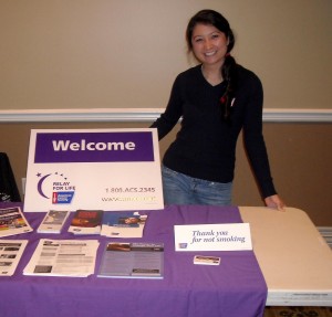 Theresa Ong thanks everyone for not smoking while standing behind the Relay for Life booth. (Becca Partridge)