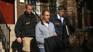 This Dec. 11, 2013 image from video provided by WJLA-TV, shows Ryan Loskarn, former chief of staff to Sen. Lamar Alexander, R-Tenn., being escorted from his Washington home by U.S. Postal Inspector police. Loskarn has been found dead in Maryland, just weeks after the former staffer's arrest on child pornography charges. The Carroll County Sheriff's office said on its website Friday that Ryan Loskarn was found dead Thursday in Sykesville, Md. Deputies say the preliminary investigation shows Loskarn may have committed suicide. (AP Photo/WJLA-TV)