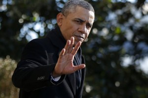 President Barack Obama waves to reporters as he walks on the South Lawn of the White House in Washington, Thursday, Jan. 30, 2014, to board Marine One helicopter, as he travels to Milwaukee, Wis. and Nashville, Tenn. (AP Photo)