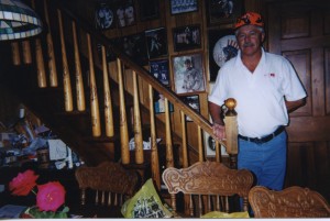Trisha Capansky interviewed James “Catfish” Hunter, Baseball Hall of Fame member, who is photographed by the staircase made of baseball bats found in his custom home he built by hand. (Trisha Capansky)