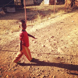 A child walking in the refugee camp. (Amy Burcham)