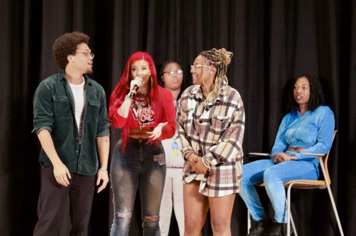 Justina Valentine on stage with dance competitors, winner Davion Primm is on the left. 