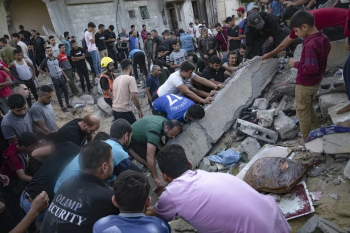 People sort through rubble
